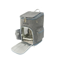 Gray pet carrier backpack with open front, featuring zippered compartments and mesh windows.