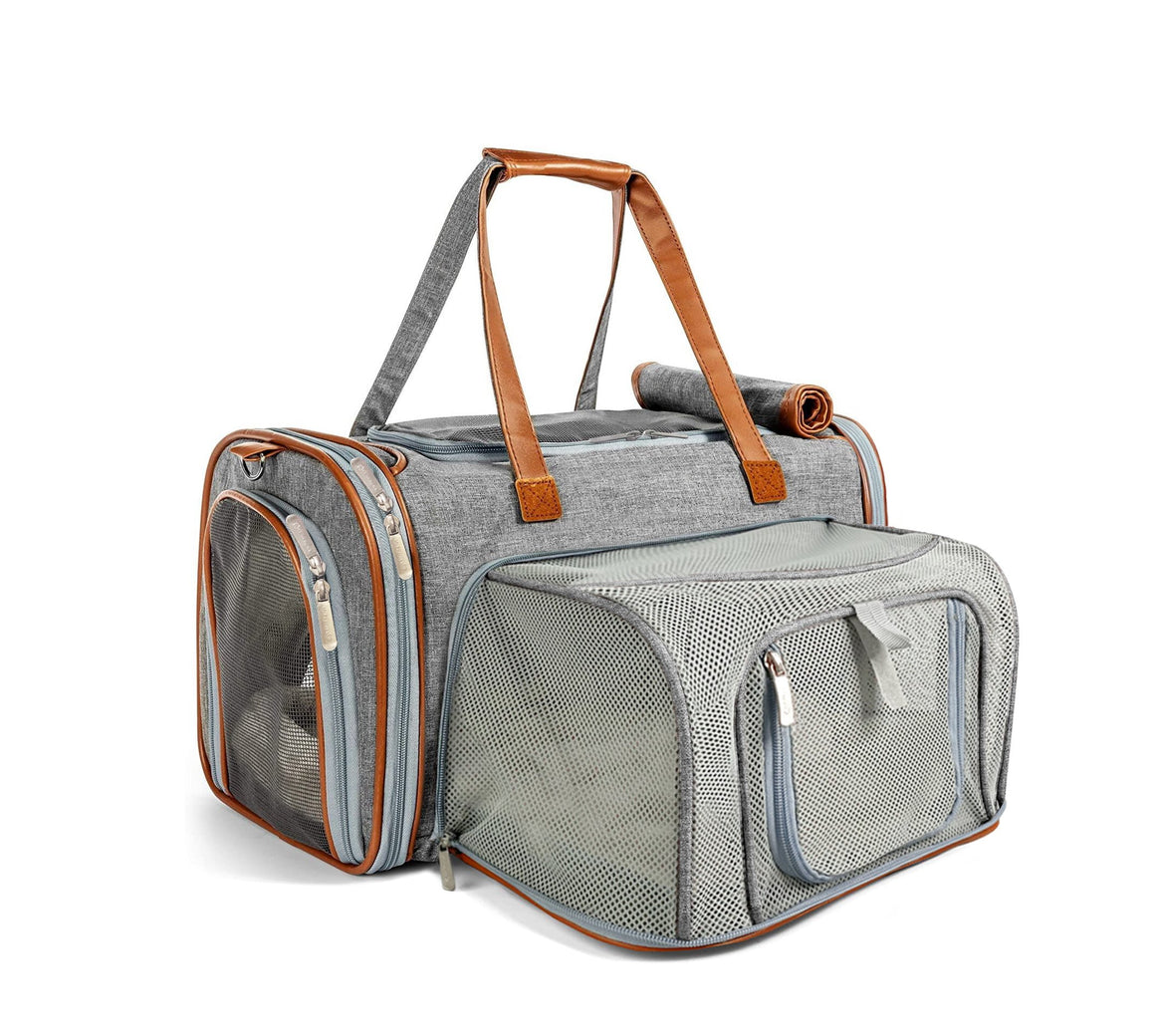 Gray pet carrier with brown handles and mesh ventilation areas.